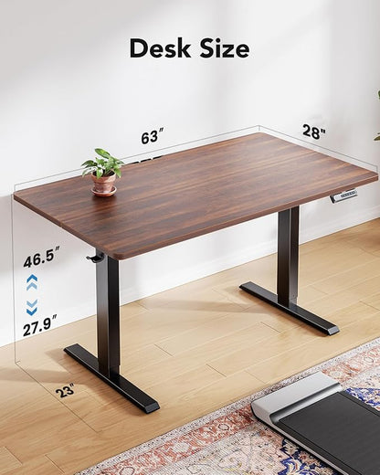 HUANUO 63" x 28" Electric Standing Desk Adjustable Height, 4 Memory Height Settings, Headphone Hook, Cable Manager, Sit Stand Up Desk for Home Office & Computer Workstation, Walnut